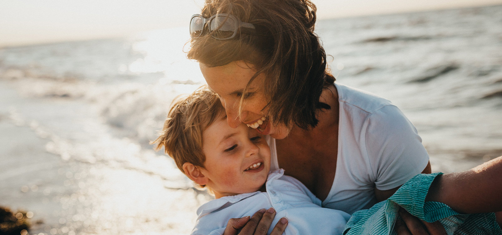Mother and son at the beach - horizontal