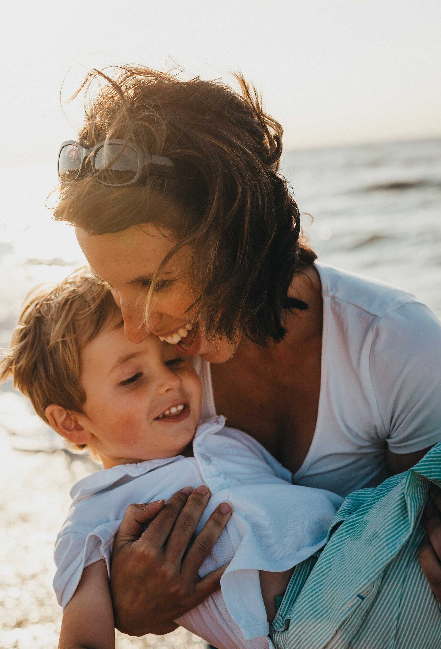 Mother and son at the beach - vertical